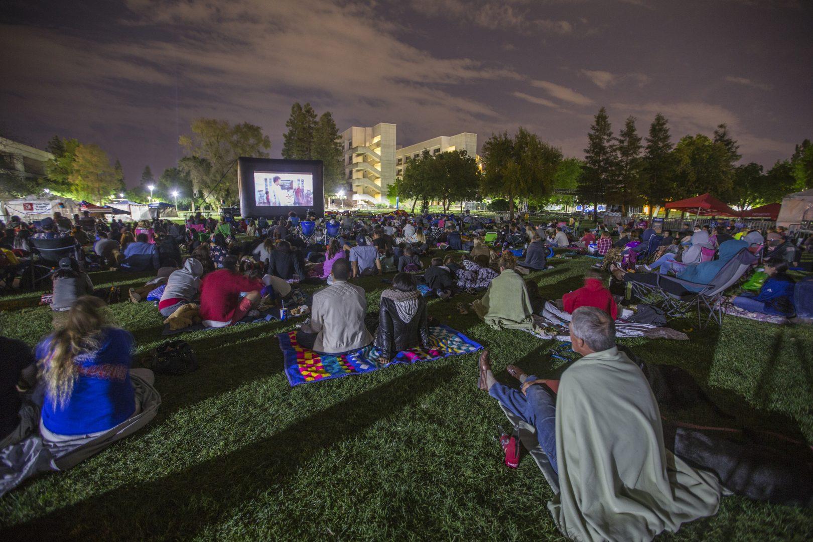 The Fresno State community watches “Back to the Future “ on Vintage Day night Saturday April 22, 2017. Back to the Future is a 1980s sci-fi film of a small-town California teen Marty McFly (Michael J. Fox), who’s thrown back into the ‘50s by a scientist friend Doc Brown (Christopher Lloyd).  (Khone Saysamongdy/ The Collegian)