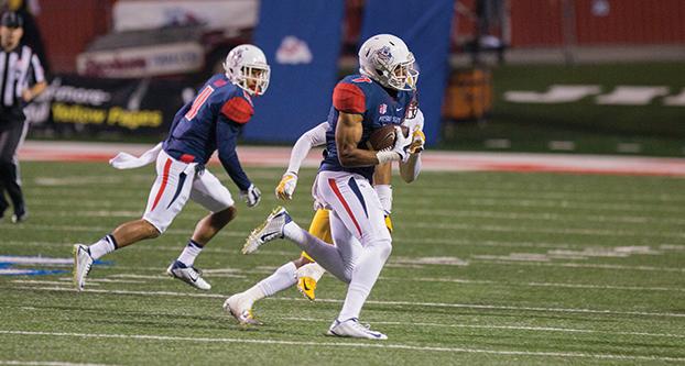 Wide receiver Aaron Peck running with the ball against the Wyoming Cowboys on Saturday, Nov. 1, 2014 at Bulldog Stadium. (Darlene Wendels/Collegian File Photo)