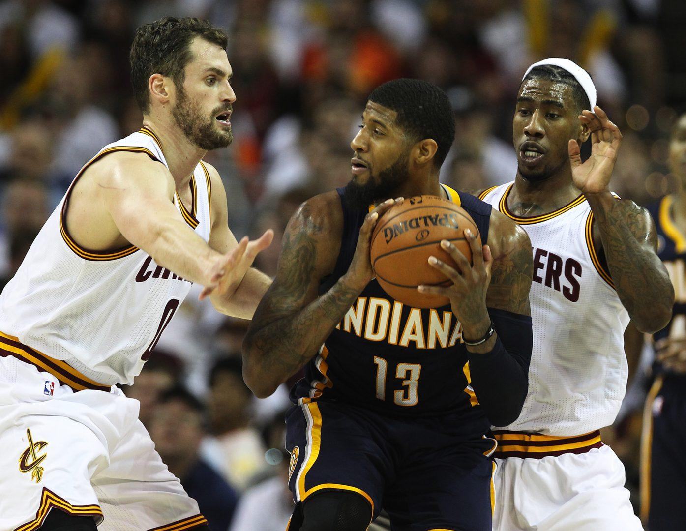 Cleveland Cavaliers forward Kevin Love and Iman Shumpert double-team Indiana Pacers forward Paul George during the third quarter in Game 2 of an Eastern Conference playoff game on Monday, April 17, 2017, at Quicken Loans Arena in Cleveland, Ohio. The Cleveland Cavaliers beat the Indiana Pacers 117-111. (Leah Klafczynski/Akron Beacon Journal/TNS)
