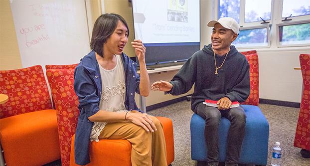 Karen Vang (left) and Vanna Nauk (right) laughs during the Queer Asian Pacific Islanders panel at the Cross Cultural and Gender Center on April 18, 2017.  (Khone saysamongdy/ The Collegian)