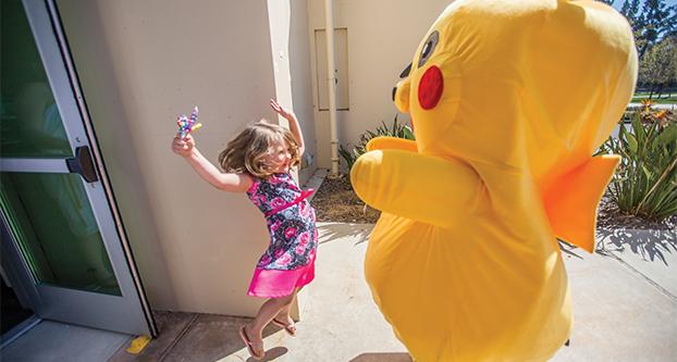 Terrathen Spurling, 4 years old, jumps in excitement to see Pikachu at FresCon outside of the North Gym on April 2, 2107. (Khone Saysamongdy/The Collegian)