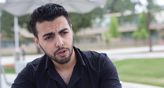 Fresno State international student Fares Al Malham, speaks to a reporter, Friday, May 5, 2017 about his experience with the uprising against the Syrian government and what it was like living in Syria. (Daniel Avalos/ The Collegian)