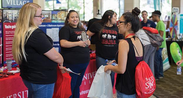 Students visit booths at resource information fair in the University Student Union during Dog Days. (Daniel Avalos/ The Collegian)
