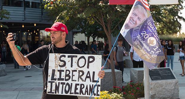 Ben Bergquam live streaming to his Facebook profile in front of Fresno States Henry Madden Library on Sept. 7, 2017. (Benjamin Cruz/The Collegian)
