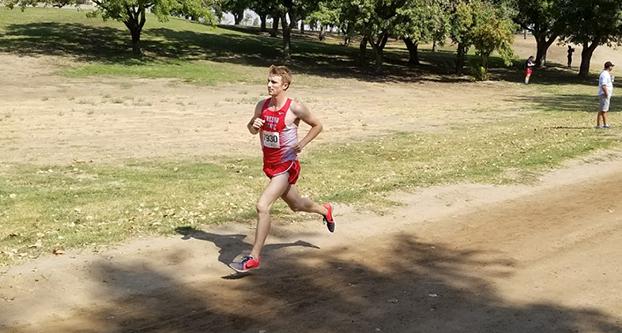 Sophomore Michael Viano competing in the Fresno Cross Country Invitational at Woodward Park on Sept. 9, 2017 (Michael Ford/ The Collegian)
