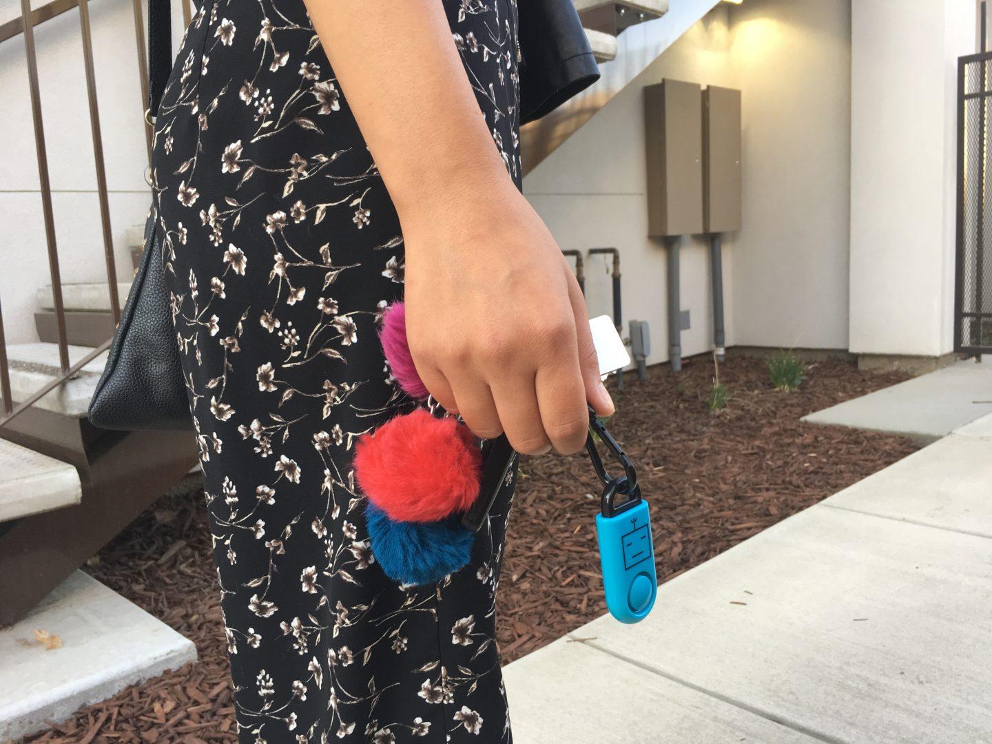 Pictured is an eAlarm on a keychain. The device is set off by pulling off the black top. A 120 decibel alarm then emits. (Jessica Johnson/The Collegian)