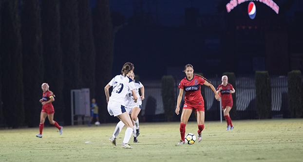 Fresno State forward Myra Delgadillo (11) runs with the ball against UC Davis on Sept. 7, 2017 at the Soccer and Lacrosse Stadium. (Megan Trindad/ The Collegian)
