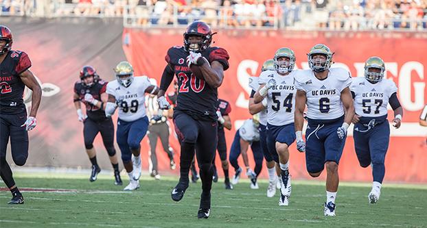 San Diego State running back Rashaad Penny (20) runs with the ball against UC Davis on Sep. 2, 2017 at Qualcomm Stadium in San Diego, California. The Aztecs won 38-17. Penny ran for 197 yards and two touchdowns. (The Daily Aztec) 
