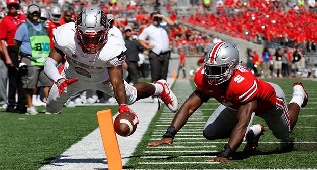 UNLV Rebels running back Lexington Thomas (3) scores a touchdown while defended by Ohio State Buckeyes linebacker Baron Browning (5) during the second quarter on Sept. 23, 2017 at Ohio Stadium in Columbus, Ohio. Ohio State won 54-21. (Barbara J. Perenic/Columbus Dispatch/TNS)