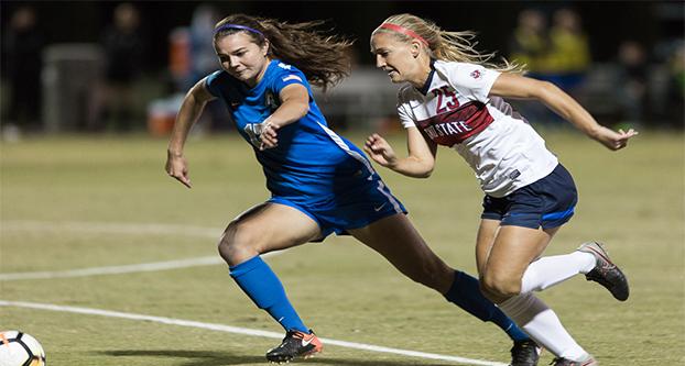 Fresno State senior Carly Bracken (25) attempts to run the ball past Air Force defender Rafaella Bucur (17) during the game at the Soccer & Lacrosse Stadium on Oct. 20, 2017. Fresno State won 1-0. (Alejandro Soto/The Collegian)
