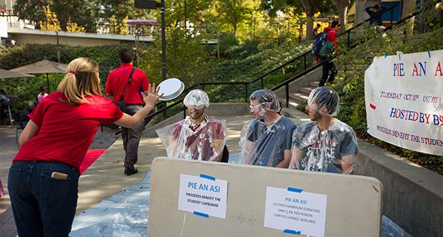 A pie gets thrown at Pie an ASI on Tuesday. The event was a part of Homecoming Week, and all proceeds from the event went to the Student Cupboard. (Benjamin Cruz/The Collegian)