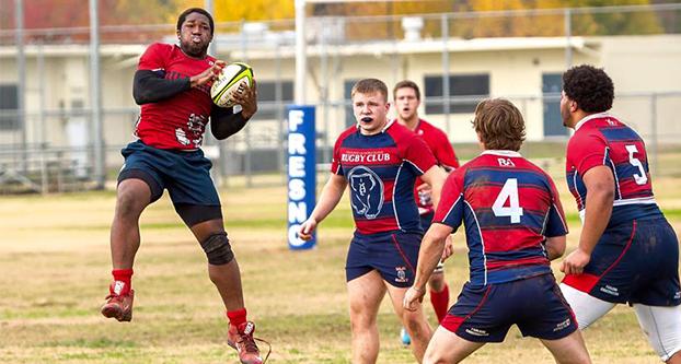 Fresno State rugby club member Matthew Ogbuehi catches the ball in a game last season. (Courtesy of Fresno State Men’s Rugby Club)