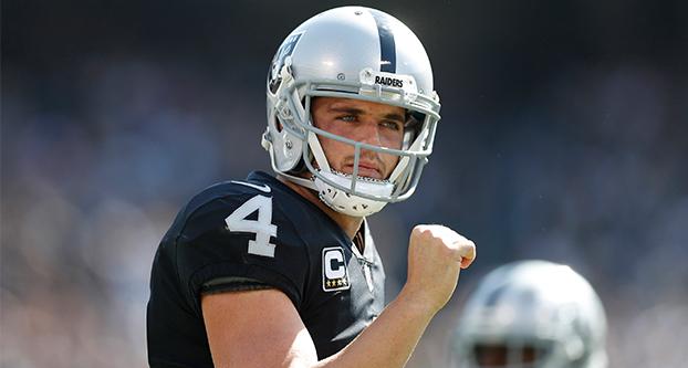 Oakland Raiders quarterback Derek Carr (4) celebrates a touchdown against the Los Angeles Chargers in the first quarter on Oct. 15, 2017 at the Coliseum in Oakland, California. (Nhat V. Meyer/Bay Area News Group/TNS)