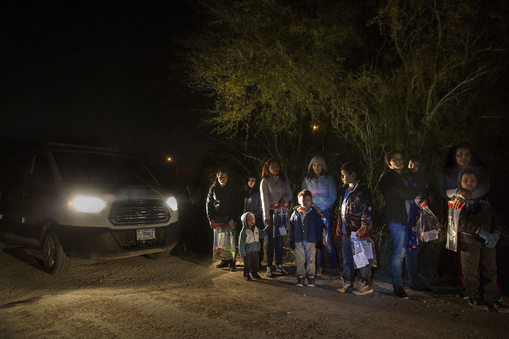 After crossing the Rio Grande River at night with the help of smugglers, a group of mainly women and children from Central America are detained by U.S. Border Patrol agents before being taken into detention on Jan. 27, 2017. The Trump administration said it will end protections for Nicaraguans, but has delayed a decision on Hondurans. (Carolyn Cole/Los Angeles Times)
