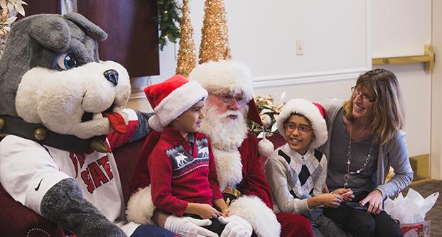 Families enjoyed taking pictures with Santa at the Smittcamp Alumni House on Saturday, Dec. 2, 2017. (Alejandro Soto/The Collegian)