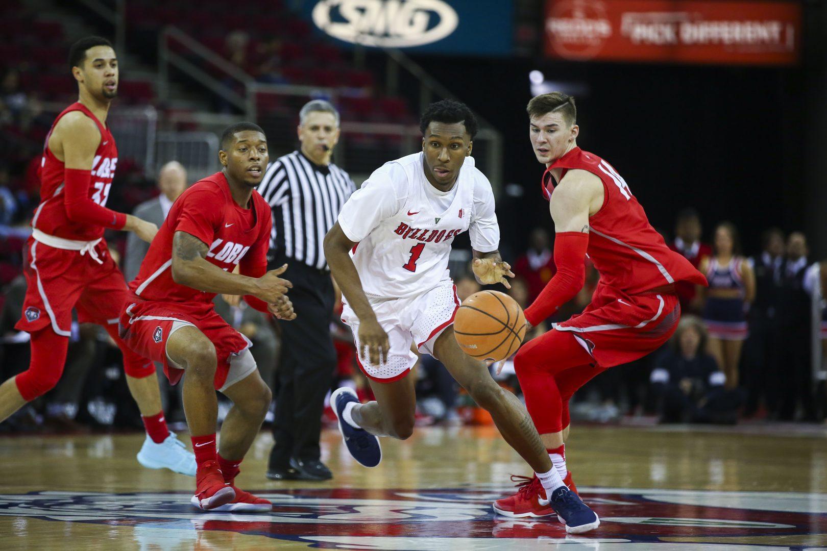 Senior Jaron Hopkins drives the ball forward against New Mexico on Saturday, Jan. 13, 2018 at the Save Mart Center.  (Ram Reyes/ The Collegian) 