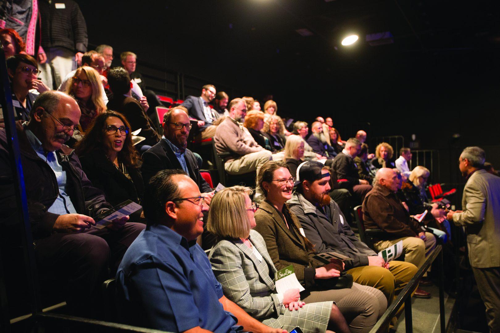 Members of the Arts and Humanities advisory board along with faculty, staff and supporters of the college gathered at the State of the College of Arts and Humanities event at the Dennis and Cheryl Woods Theatre on Jan. 18. (Benjamin Cruz/The Collegian)