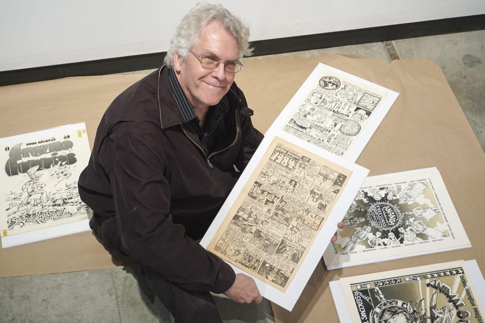 Doug Hansen showcases comics he created for the Daily Collegian as a student in the 1970s in the Conley Art Gallery on Friday, Jan. 19, 2018. (Eric Zamora/The Collegian)