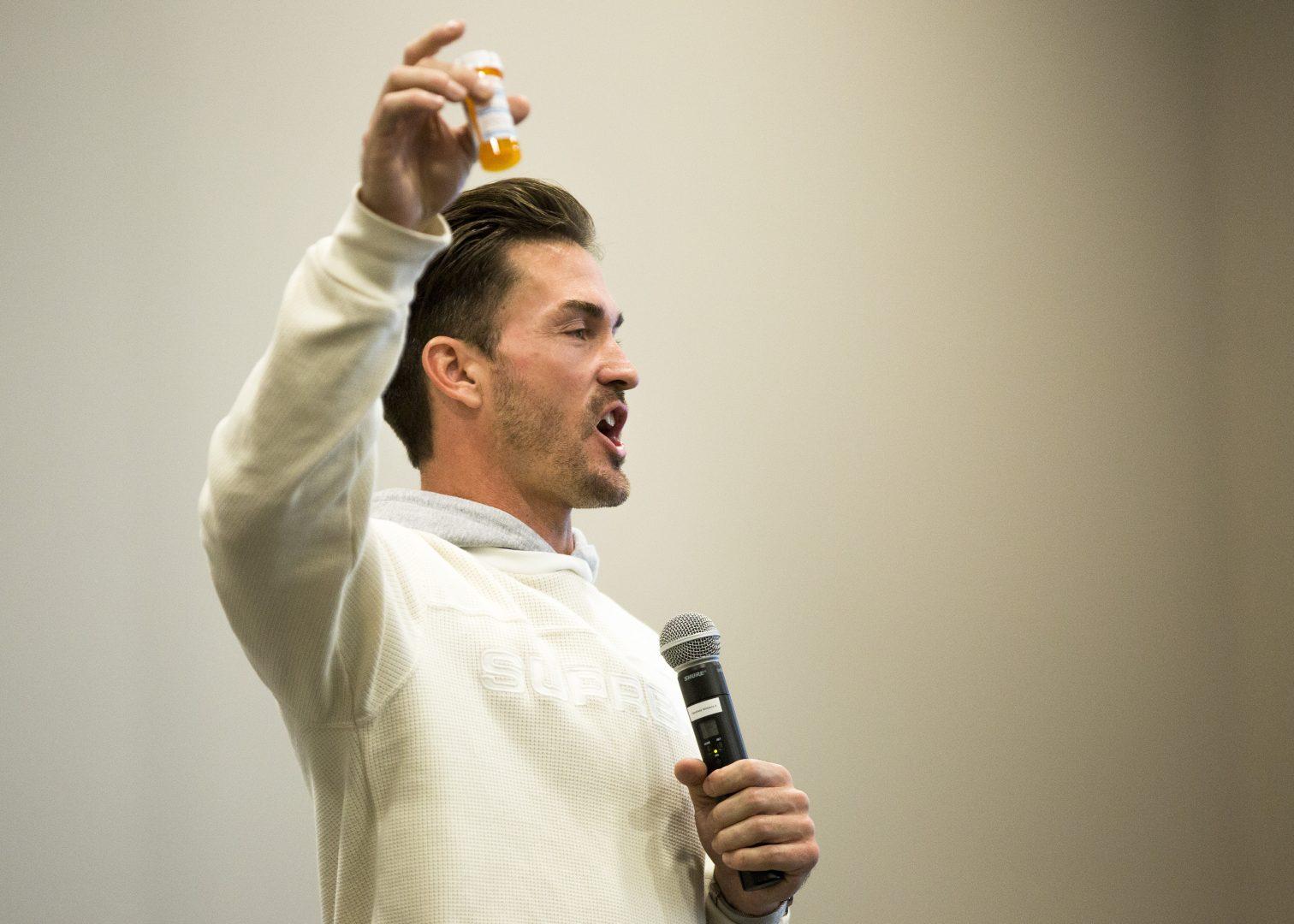 .Motivational speaker Tony Hoffman holds up an empty prescription bottle for Oxycontin as he speaks about the insidious nature of addiction to prescription medication during the “Substance Use” panel held in the North Gym on Feb. 22, 2018. (Ramuel Reyes/The Collegian)