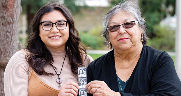 Fresno State Senior Elizabeth Meza-Castillo and her grandmother, Martha Quintana-Sanchez,  holds up a photo of Quintana-Sanchez in her youth on Jan. 29, 2018. (Ram Reyes/The Collegian)