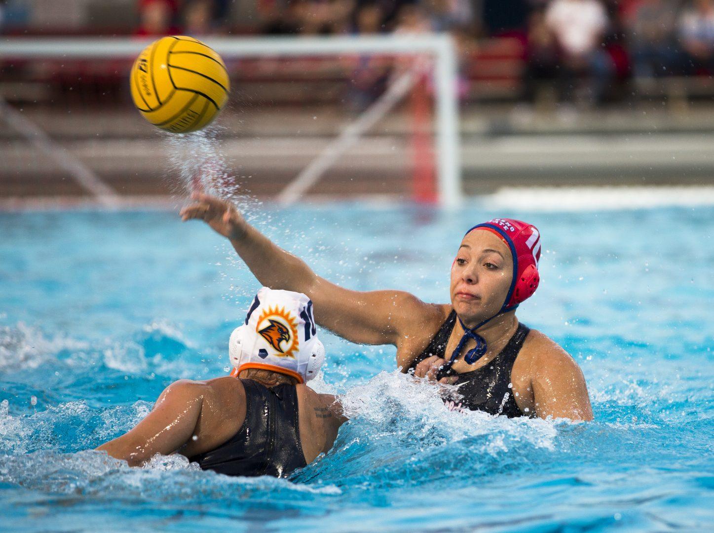Freshman center Megan Greenwood passes the ball against Fresno Pacific during the inaugural home game at the aquatic center on Feb. 9, 2018.
 Fresno State won 16-6.(Ramuel Reyes/The Collegian)