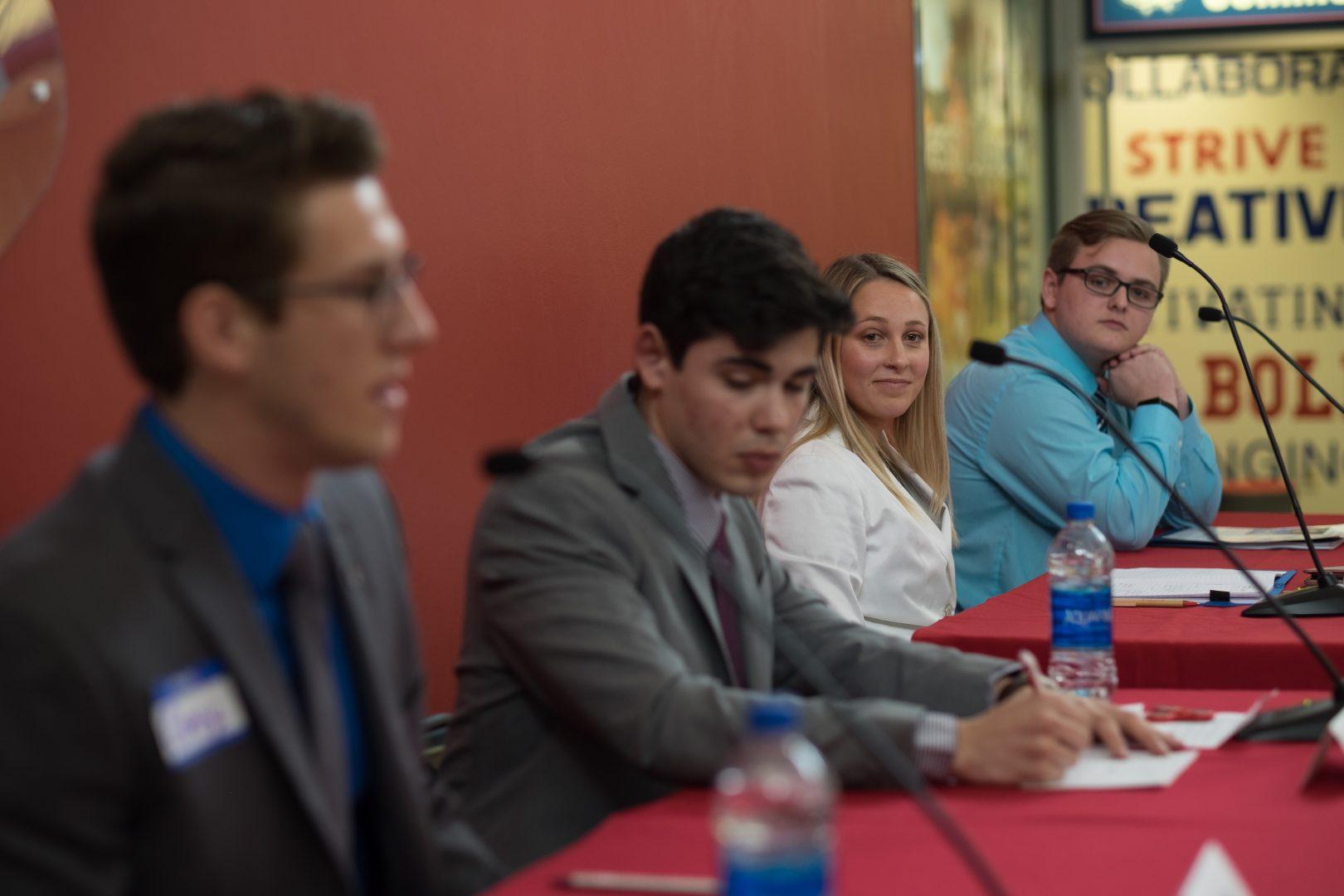 The ASI presidential candidates Corey Miracle, Sebastian Wenthe, Demi Wack and Carter Pope II during the ASI Presidential Debate in the USU on March 16, 2018. (Ram Reyes/The Collegian)