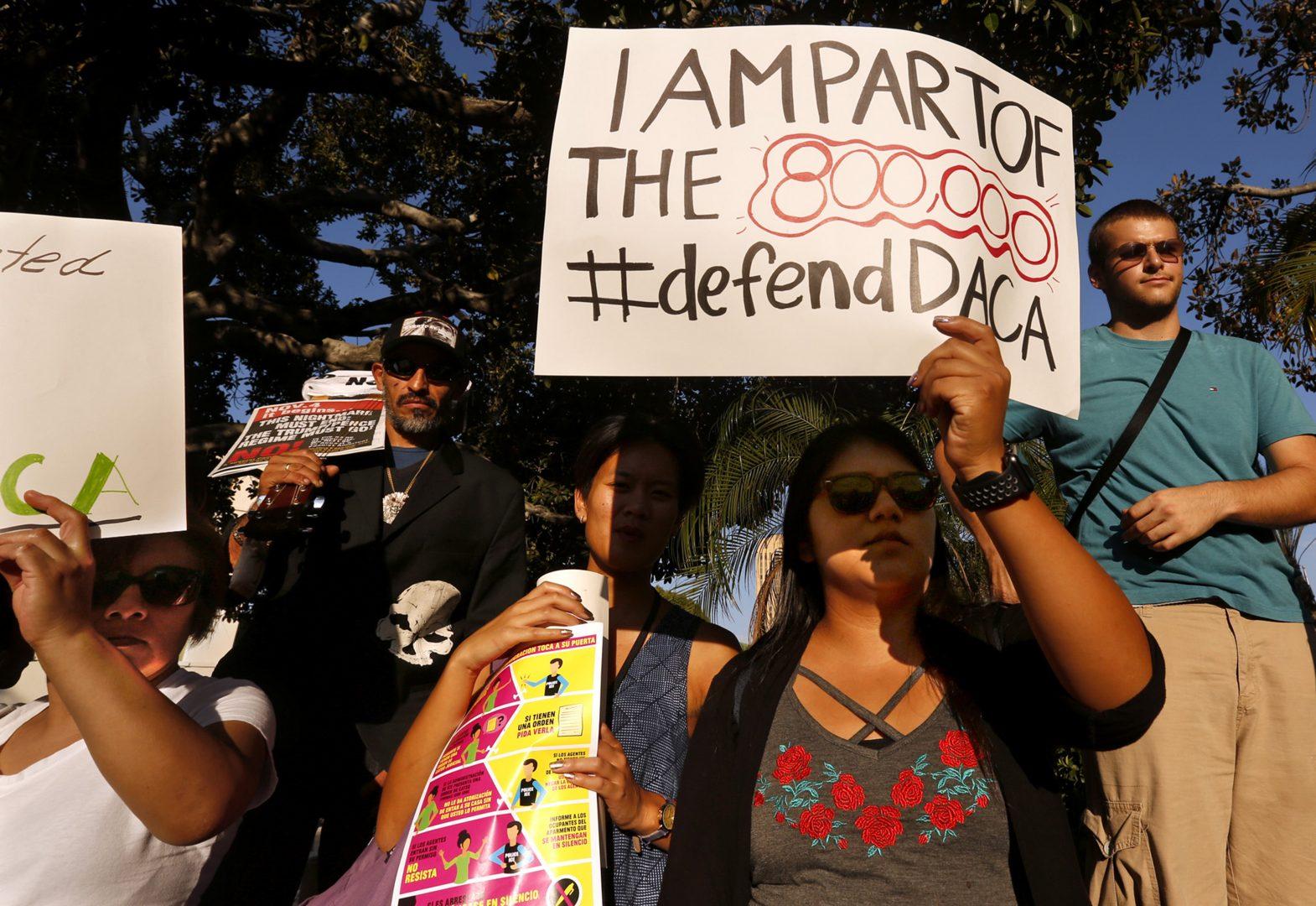 Los Angeles Harbor College student Brenda Soriano, second from right, and her mother Edilbertha Martinez, left, participate in a rally in support of the Deferred Action for Child Arrivals, or DACA program in Los Angeles on September 5, 2017. (Genaro Molina/Los Angeles Times/TNS)