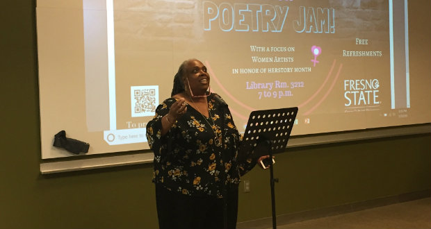Dr. Francine Oputa, director of the Cross Cultural and Gender Center, participates in a poetry jam in honor of Women’s History Month in the library on March 8. (Bineet Kaur/The Collegian)