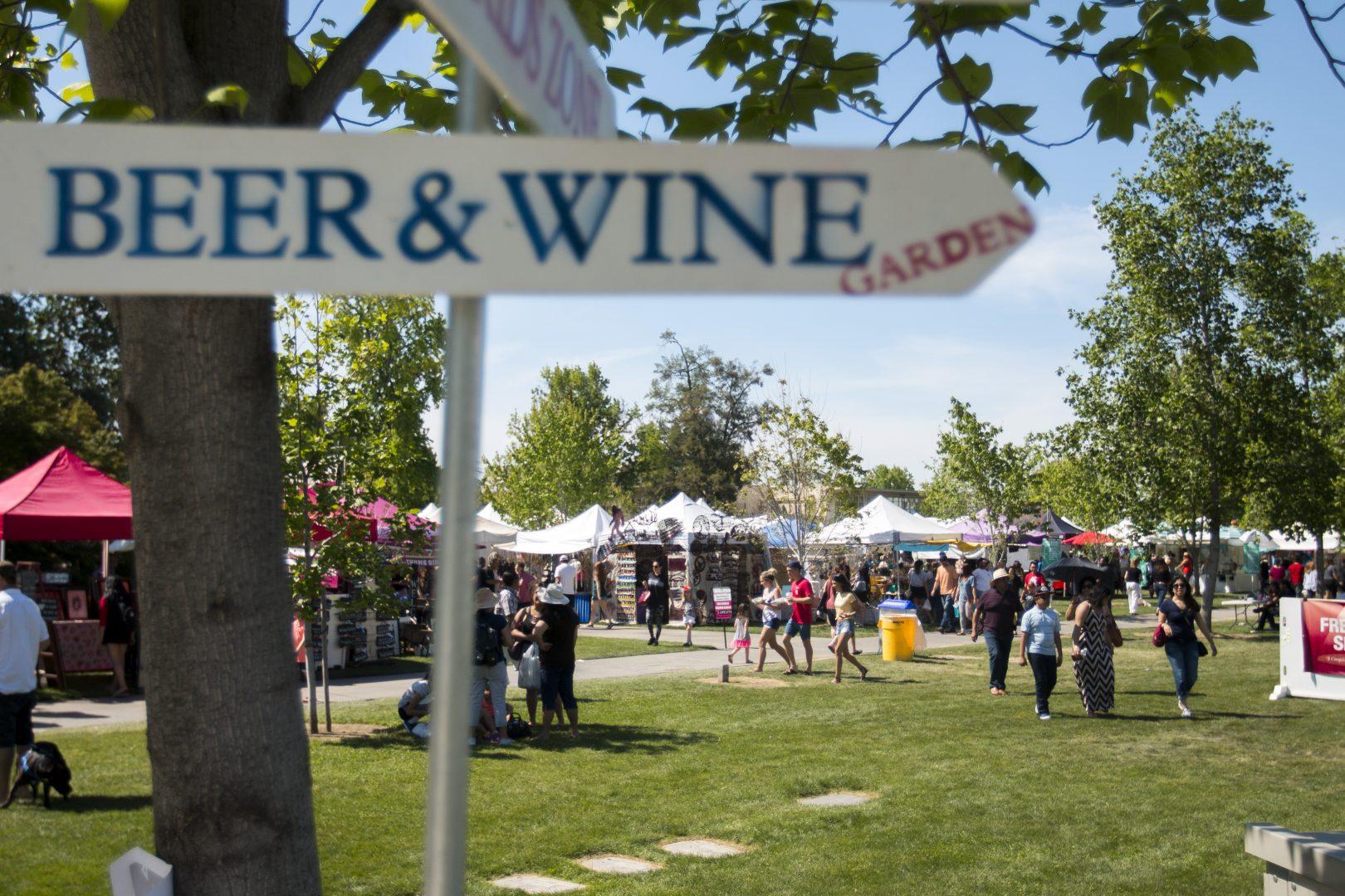 The sign pointing to the Beer & Wine Garden, one of the most popular attractions, at Vintage Days on April 22, 2018. (Ramuel Reyes/The Collegian)