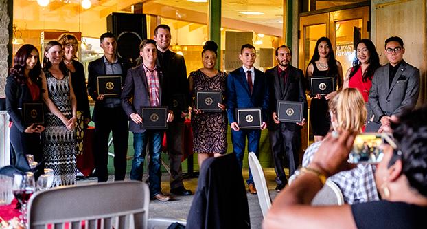 Inductees of the Pi Sigma Alpha hold their certificates during the induction at the Belmont Country Club on April 26, 2018. (Ramuel Reyes/The Collegian)