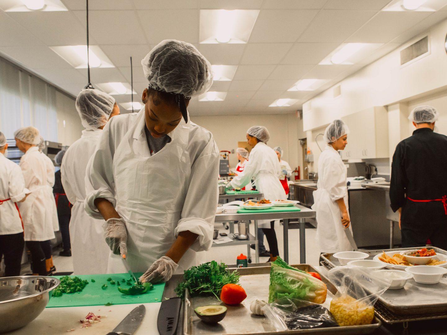 The Fresno State women’s basketball team learns how to cook during a session with students from the nutrition and dietetics department. (Aly Honore/The Collegian)