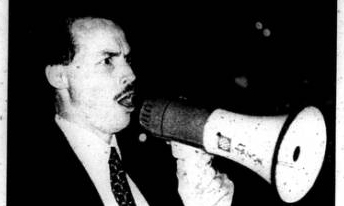 Then-California KKK Imperial Dragon Chris Johnson shouts a white power message in the Fresno State Free Speech Area on Nov. 17, 1997. (Archive)