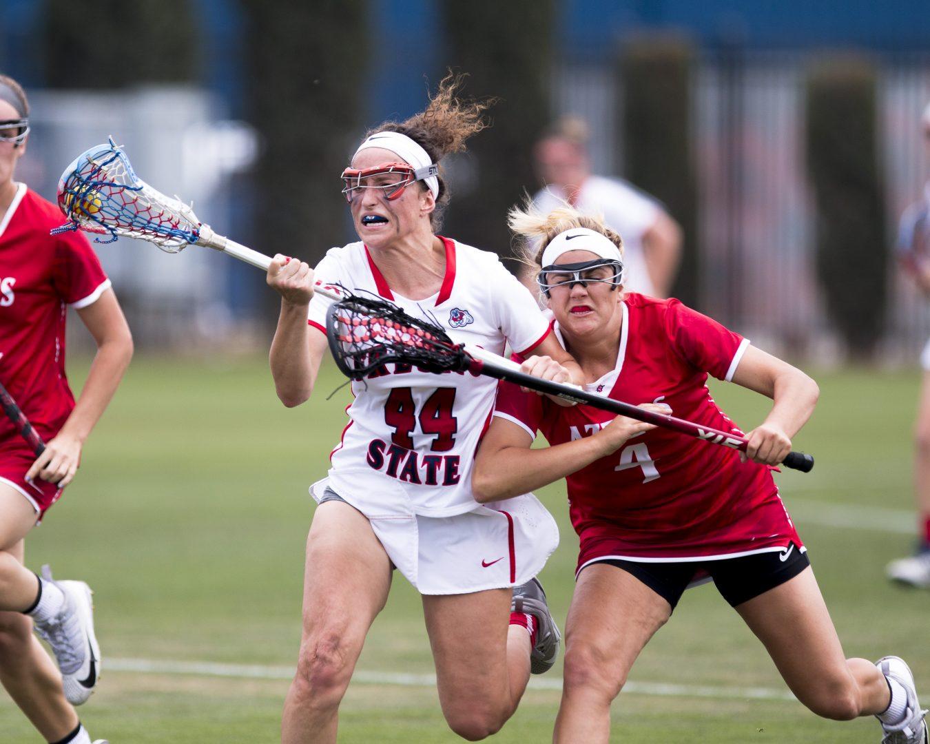 Senior Abigail Bergevin battles against San Diego State on April 15, 2018 at the Soccer and Lacrosse Field. The ‘Dogs lost 15-11. (Ramuel Reyes/ The Collegian) 