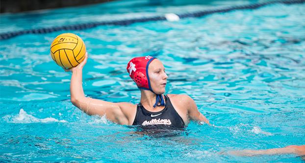 Freshman Callie Woodruff prepares to pass the ball during a game against UC San Diego at the Fresno State Aquatic Center on March 31, 2018. The ‘Dogs lost 13-11. (Jorge Rodriguez/ The Collegian) 