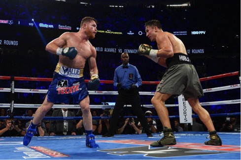 Saul Alvarez and Gennady Golovkin meet up in the center of the ring during their first match at the T-Mobile Arena in Las Vegas Nevada on Saturday, Sept. 16, 2017. (HBO)