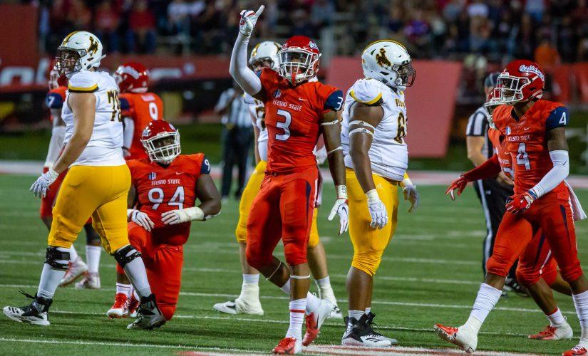 Fresno State defensive end Mykal Walker celebrates as the Bulldogs stop the Wyoming
Cowboys short of the first down in their 27-3 victory Saturday night, Oct. 13, 2018. (Jose Romo/The Collegian)
