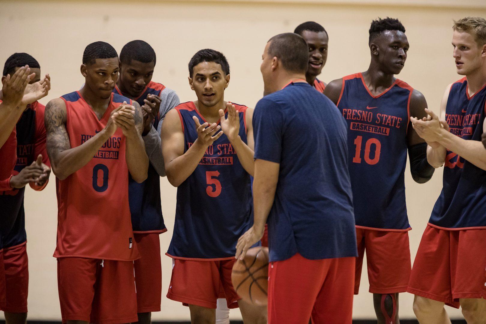 New Bulldogs mens basketball coach Justin Hutson pumps up his team during practice. Sept. 27, 2018. (Keith Kountz/Fresno State Athletics)