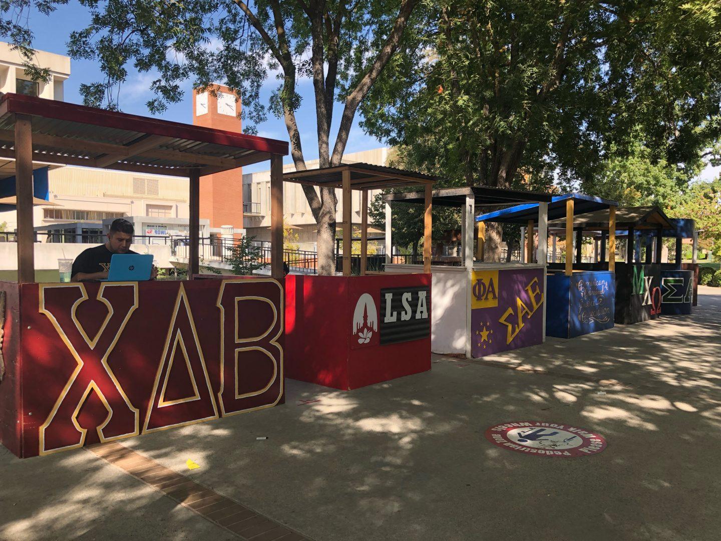 Booths for clubs and Greek Life line the Fresno State walkway outside the USU on Sept. 28. (Marilyn Castaneda/The Collegian)