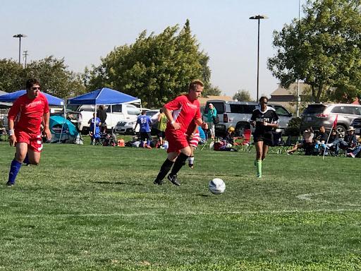 Alexander Wiens (center) playing soccer with the Wayfinders Program (Photo courtesy of Angela Wiens).
