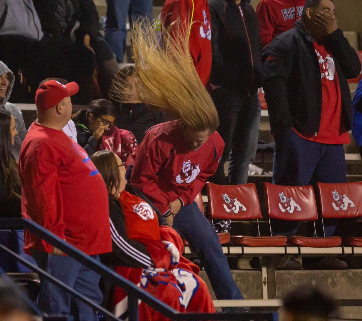 A hair-flipping fan at the Fresno State football game against San Diego went viral after he was caught celebrating a bit too much. (Jose Romo/The Collegian)
