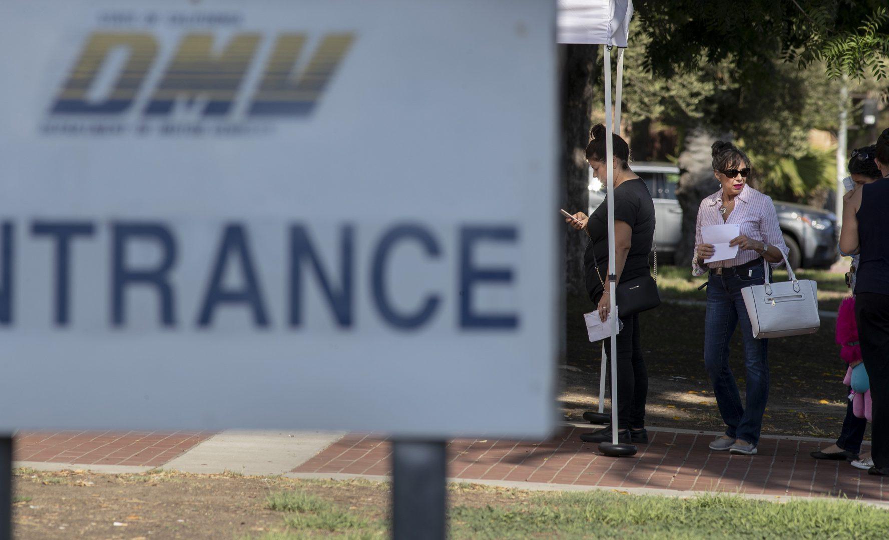 People wait in line for DMV service in Winnetka on Sept. 5. (Brian van der Brug/Los Angeles Times/TNS)