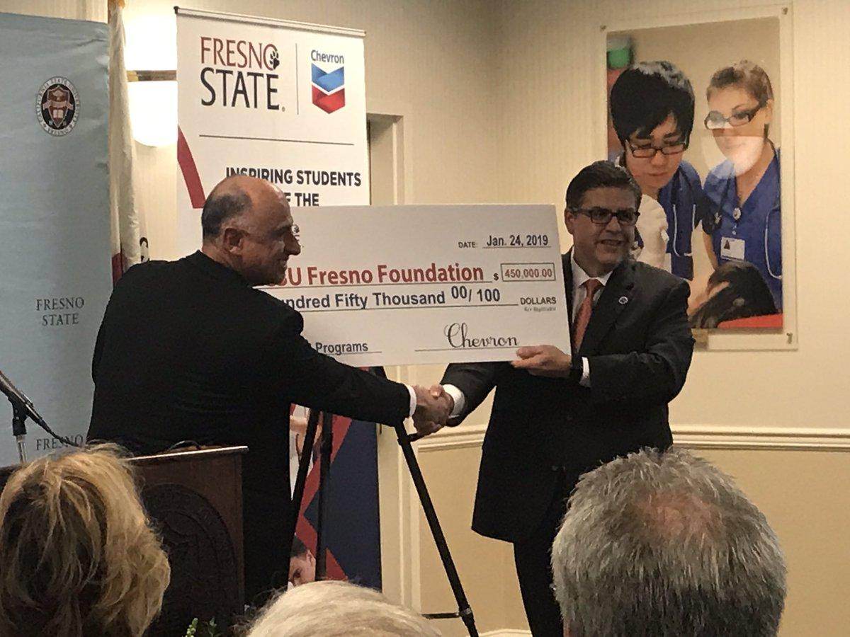 Chevron reservoir supervisor Marc Guzman presents a check for $450,000 to Fresno State President Dr. Joseph I. Castro on Jan. 24, 2019. The donation will go toward supporting STEM and other programs at the university. (Courtesy of Fresno State)