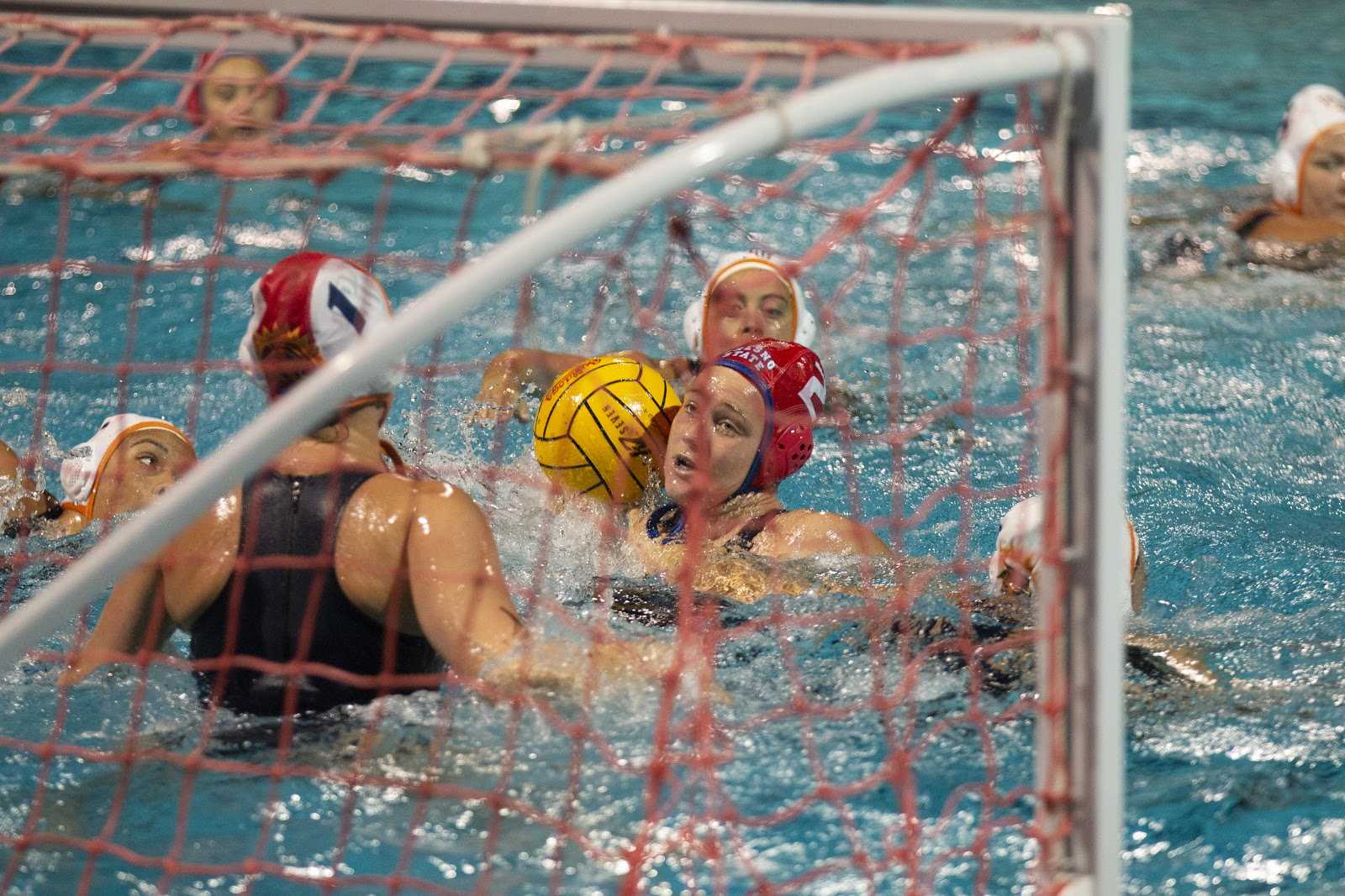 Fresno+State+water+polo+player+Emily+Nicholson+gets+ready+to+shoot+while+surrounded+by+Fresno+Pacific+University+players+during+a+home+match+on+Friday%2C+Feb.+8%2C+2019.