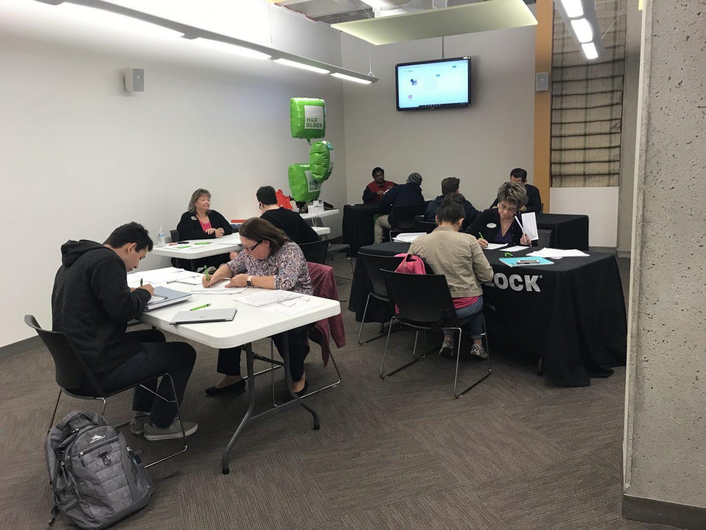 Students get help preparing their taxes from H&R Block members during the Love and Taxes event, hosted by Fresno State’s Money Management Center on Feb. 14. (Vanessa Rios/The Collegian)