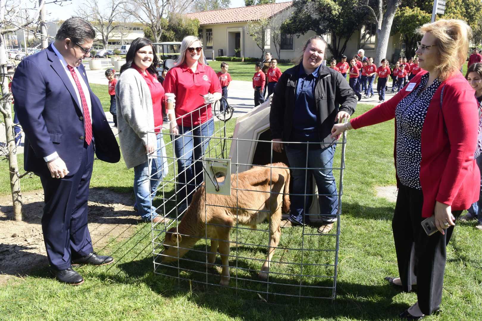 Fresno State President Dr. Joseph I. Castro and his wife Mary obsvere a livestock exhibit during National Ag Day on Thursday, March 14, 2019. (Geoff Thurne/Jordan College of Agricultural Sciences and  Technology)