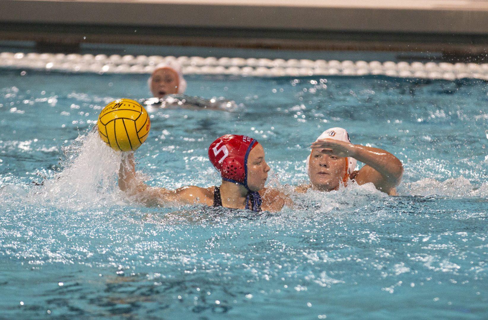 Fresno State water polo player Daphne Guevremont gets ready to pass the ball during a home match against Fresno Pacific University on Friday, Feb. 8, 2019.