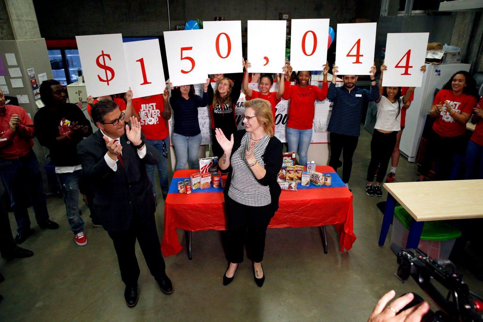 Fresno State President Dr. Joseph I. Castro and Mary announce the donation total for the Student cupboard from 2018 March Match Up fundraiser. (Carey Edmunson/ Courtesy Student Cupboard)