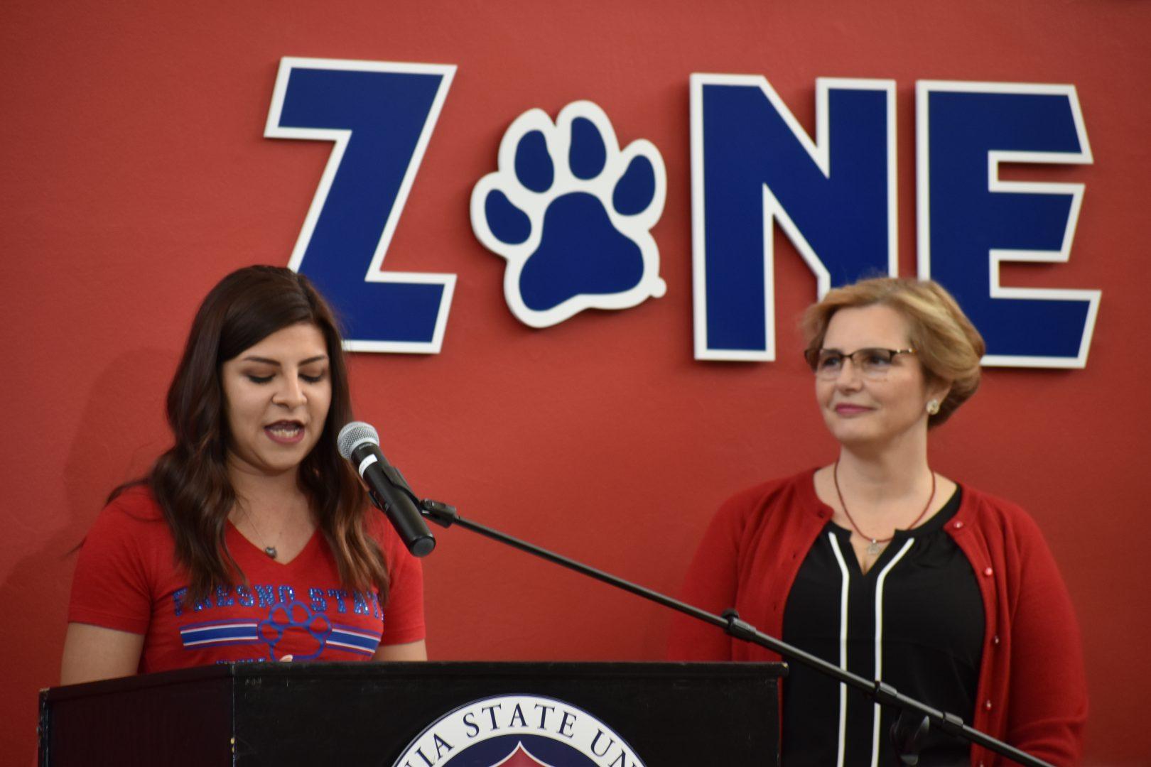 ToniMarie Munoz (left), a Fresno State senior, speaks about how she has benefited from the Student Cupboard as Fresno States first lady Mary Castro (right) looks on at the March Match Up result unveiling on April 5, 2019. (Payton Hartung/The Collegian)