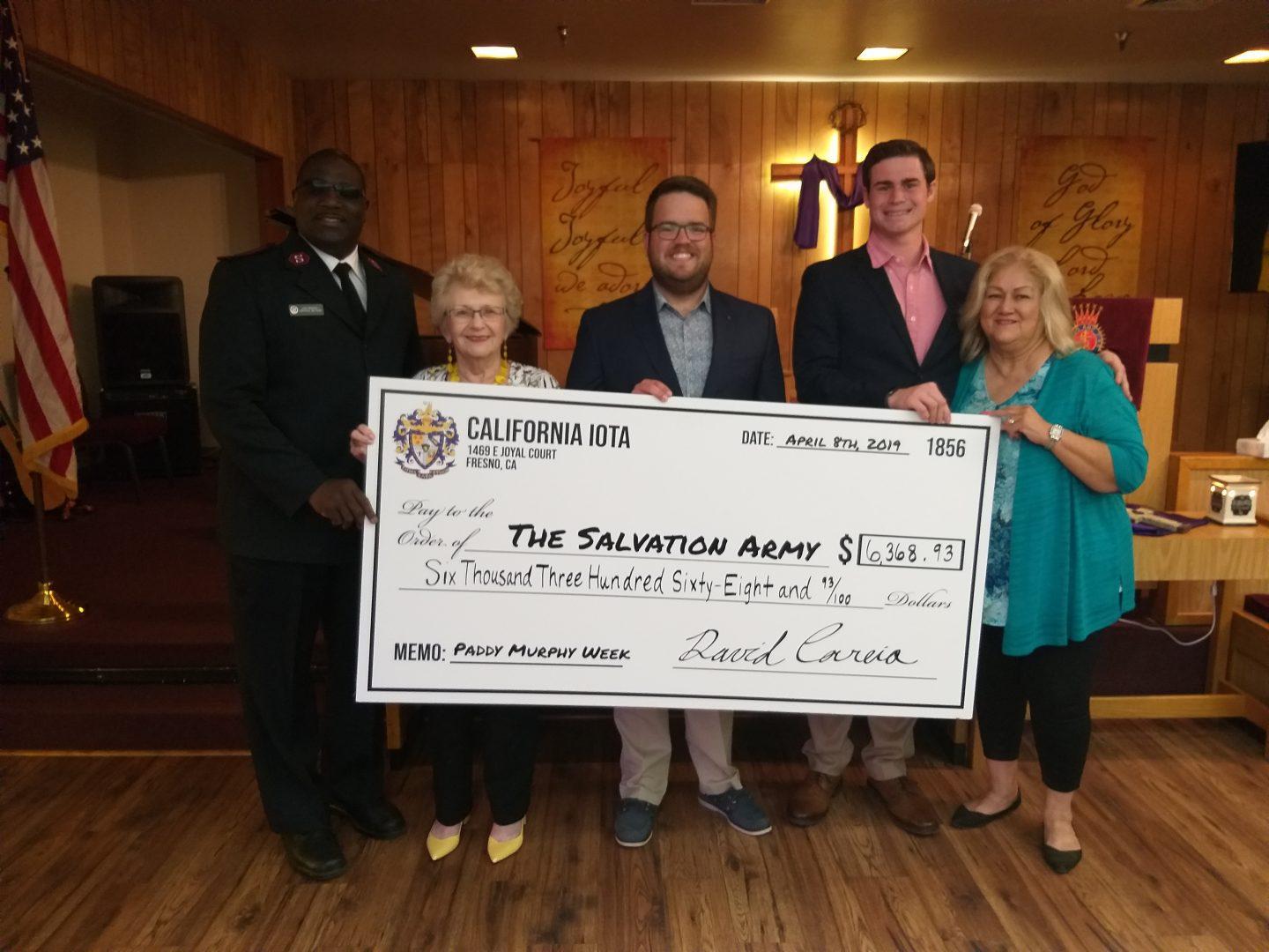 Lt. Lee Vale Butler, Merjean Webster, Grant Rogers, Ryan Dami, & Anita Miranda (Left to right)  at the check presentation for the Salvation Army.  (Courtesy Fresno State Sigma Alpha Epsilon)