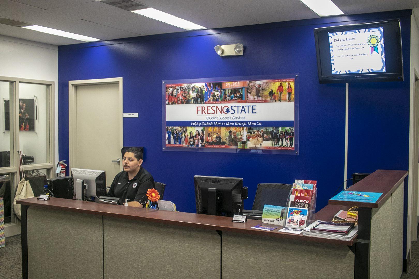 Omero Bobadilla works the front desk of the Fresno State Success Center, which houses the Dream Success Center, on Tuesday April 9, 2019. (Larry Valenzuela/ The Collegian)